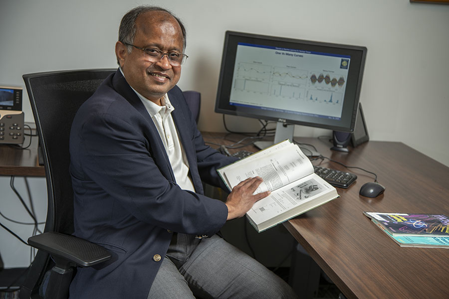 Professor Swaminathan with a computer